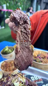 A fast-paced montage showcasing a BBQ platter, brisket, mac and cheese, and cocktails at Big Tray BBQ, located within the Freight Island venue in Manchester.