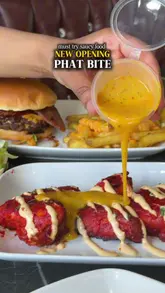A fast-paced promotional montage showcasing a variety of burgers, loaded fries, wings, and desserts at Phat Bite, a casual dining venue.