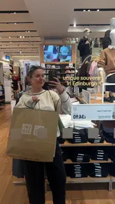 A creator visits a Uniqlo store in Edinburgh to showcase the Irn-Bru collaboration, including embroidery services and custom printing, followed by a visit to the in-store Katsu 100 cafe for a matcha latte.