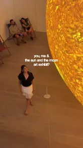 A short, montage-style video showcasing the 'Sun and The Moon' art exhibition at the Saatchi Gallery in London, featuring various large-scale installations and light-based artworks.