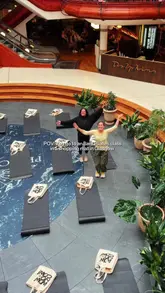 A vlog-style reel showcasing a community Pilates class held in Princes Square shopping mall to celebrate the first anniversary of The Delphine cafe in Glasgow, featuring shots of the class, the cafe interior, and branded goody bags.
