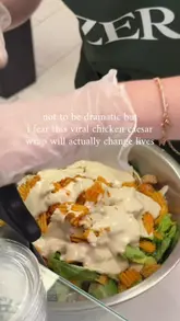 A short, engaging video showing the preparation of a chicken caesar wrap at a venue in Mayfair, including the addition of crisps.