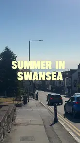 A personal vlog documenting a sunny summer day in Swansea, featuring a cafe breakfast, a trip to Llangennith beach, and a pub meal at the King Arthur Hotel.