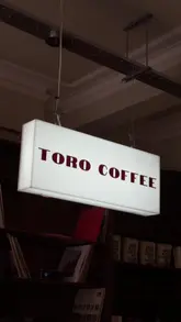A montage video showcasing the interior, menu, and atmosphere of Toro Coffee in Glasgow, highlighting its return as a local community spot.