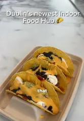 A creator visits Hungr Hub in Sandyford, Dublin, providing a tour of the various food vendors available, including Tuckk Inn, Dos Burritos, Crumble Crown, and Lume.