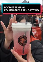 A vlog-style review of various food and drink vendors at the Foodies Festival in Rouken Glen Park, featuring taste tests of sodas, pasta, street food, and desserts.