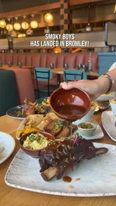 A promotional reel showcasing the new Smoky Boys location in Bromley, highlighting their menu of smoked meats, gourmet burgers, and seafood dishes in a stylish, park-view setting.