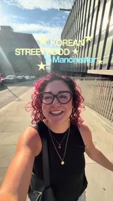 A vibrant, creator-led vlog showcasing the relaunch of Bunsik, a Korean street food venue in Manchester, highlighting the ordering process, a variety of popular dishes like corn dogs and tteokbokki, and the energetic K-pop atmosphere.