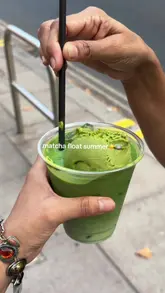 A short, handheld clip featuring a matcha float being stirred and sampled. The video focuses entirely on the drink, showcasing the texture of the matcha ice cream and the drink itself.