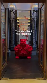 A cinematic tour of a high-end sushi restaurant located within a hotel, showcasing the elegant interior, the sushi counter, the preparation of dishes, and the overall dining experience.