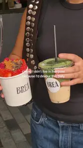 A short, punchy reel showcasing açaí bowls and matcha drinks from a food truck called Brea in Liverpool. The video features close-up shots of the colourful food and the stall, accompanied by a relatable text overlay expressing a desire to visit daily.