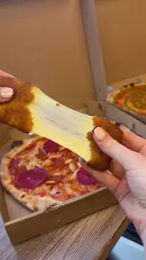 A review of Denni's Pizza in Glasgow, showcasing their Montreal-style pizzas, chicken tenders, mozzarella sticks, and wraps.