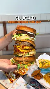 A promotional reel for Cluck'd, a new grilled chicken restaurant in Leicester, showcasing their menu items including burgers, loaded fries, rice boxes, and sides, alongside the venue's interior.