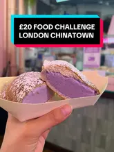 A creator takes on a £20 food challenge in London's Chinatown, visiting multiple stalls to try various snacks and drinks, including oyster fritters, an ube ice cream sandwich, taiyaki, and bubble tea.