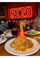 A short, aesthetic montage showcasing pasta dishes, starters, wine, and dessert at Sugo Pasta in Glasgow, set to music with minimal text overlay.