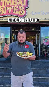 A creator reviews a large mixed grill platter from Mumbai Bites in Bradford, detailing the components of the meal and emphasizing its value for money.
