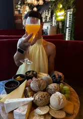 A short, upbeat video showcasing a bottomless brunch experience at The Residence Bar & Kitchen, featuring a large picnic-style sharing board and DIY prosecco cocktails.