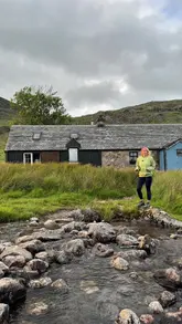 A travel vlog featuring a visit to McCook's Bothy in Scotland, sharing local ghost stories and showcasing the remote location and interior.
