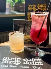 A montage showcasing the retro, vinyl-themed atmosphere and casual dining menu at Strip Joint in Glasgow, featuring cocktails, burgers, and pizzas.