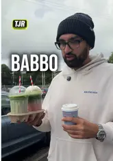 The creator visits Babbo, a cafe in Glasgow, to review their coffee and drinks. He provides a personal assessment of the matcha and flat white, while also giving a brief tour of the venue's interior and outdoor seating area.