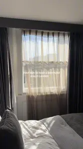 A short, handheld video tour of a hotel room at Eccleston Square Hotel in London, highlighting the room's features, bathroom amenities, and the view from the window.
