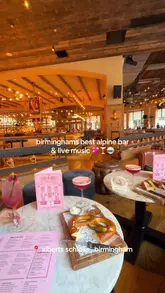 A fast-paced video tour of Albert's Schloss in Birmingham, highlighting the alpine-inspired decor, live music, shuffleboard, and cocktail offerings.