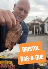 The Food Guy reviews a monthly smoked meat BBQ pop-up based in Bristol, showcasing a box containing three types of meat, pickles, homemade sauce, and two sides, plus a cheesecake dessert.