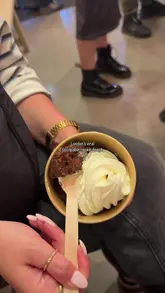 A short, energetic reel capturing a visit to Puffy in Soho to try their viral scoopable cookie dough, featuring close-ups of the product being served and the shop's interior.