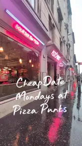 A promotional video for Pizza Punks in Glasgow, showcasing their 'Cheap Date Mondays' offer. The video features close-ups of sourdough pizzas, cocktails, and the restaurant's interior, accompanied by a voiceover explaining the deal and the menu options.