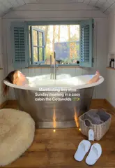 A short, aesthetic montage showcasing a relaxing morning in a cabin at The Fish Hotel in the Cotswolds, featuring a breakfast spread, a cozy fireplace, and a scenic view.