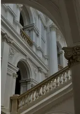 A montage of high-quality, cinematic shots featuring the exterior of The Savoy, the restaurant's interior, champagne service, and various plated dishes at Restaurant 1890 by Gordon Ramsay.