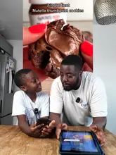 A father and son attempt a 3-ingredient Nutella cookie recipe in their home kitchen, providing a humorous and relatable cooking tutorial.