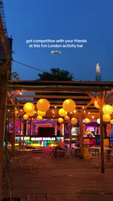 A group of friends visits an activity bar called Crazy Boules at Mercato Metropolitano, showcasing the boules game, the scorecard, and the photo booth/podium area.
