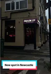 A promotional video for a new burger and pizza spot called Smash Up in Newcastle, showcasing the exterior, menu, and various food items like burgers, pizza, and wings.