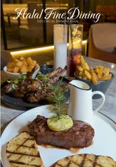 A polished promotional video for Decorum in Birmingham, featuring high-quality shots of the restaurant's elegant interior, plated dishes like steak and lamb cutlets, and various mocktails.