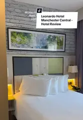 A detailed room tour and review of the Leonardo Hotel Manchester Central, showcasing the standard double and twin room layouts, bathroom facilities, and the hotel's proximity to public transport links.