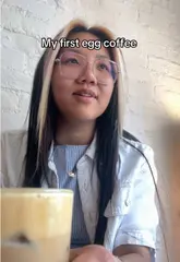 A creator visits Tranquil 1992 to try Vietnamese egg coffee and coconut coffee for the first time, sharing their reaction in a casual vlog format.