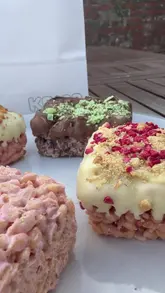 A creator and a child review 'Krisp' rice crispy treats, showcasing different flavours like Mint Choc, Biscoff, and Strawberry Cheesecake.