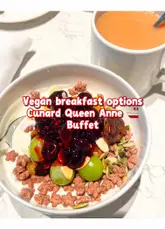 A video showcasing the vegan breakfast buffet options available on the Cunard Queen Anne cruise ship, highlighting specific items like bread, fruit, cereals, and custom porridge.