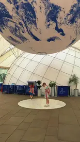 A vlog-style video showcasing a family visit to Dynamic Earth in Edinburgh, highlighting the interactive science exhibits, planetarium, and the on-site Core Cafe.