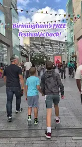 A fast-paced montage showcasing the Birmingham Weekender festival, highlighting various family-friendly activities, live performances, street entertainment, and food options available in the city centre.