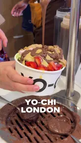 A vlog-style review of the new Yo-Chi frozen yogurt shop in London, covering the queue, the self-serve process, the variety of toppings, the pay-by-weight pricing, and a taste test.