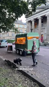 A vlog-style review of a pizza truck called Dough Man's Land, located near Kelvingrove Park in Glasgow. The video highlights the affordability and quality of the wood-fired pizzas, showing the preparation process and the creator enjoying the food.