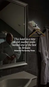 A couple reviews their stay at The Cawdor, a historic Georgian coaching inn in Llandeilo, highlighting the spacious room, impressive shower, historic atmosphere, and breakfast.