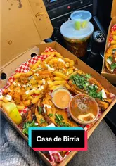 A short video showcasing a takeaway order from Casa De Birria, featuring birria tacos, loaded fries, and birria ramen. The video focuses on the food, demonstrating the dipping process and the quality of the ingredients.