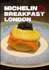 The video provides a detailed review of the breakfast tasting menu at Pavyllon, located within the Four Seasons Hotel in London. It features a variety of courses, including pastries, lobster flatbread, chia pudding, and French toast, along with drink pairings. The creator shares their experience of the meal, highlighting the unique nature of a Michelin-starred breakfast.