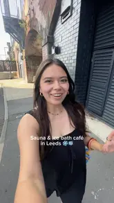 A vlog-style tour of Kontrast, a sauna and ice bath cafe located under railway arches in Leeds, highlighting the facilities and the cafe area.