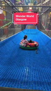 A vlog-style tour of a soft play centre in Glasgow following a refurbishment, highlighting new features like an inflatable area, a tubby slide, and a role-play village, as well as the on-site cafe.