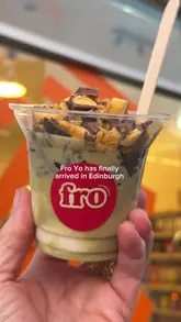 A short, energetic video showcasing a frozen yogurt pop-up in Edinburgh. The creator highlights the menu, the dispensing process, the topping options, and the shop's interior, providing a quick and appealing look at the experience.